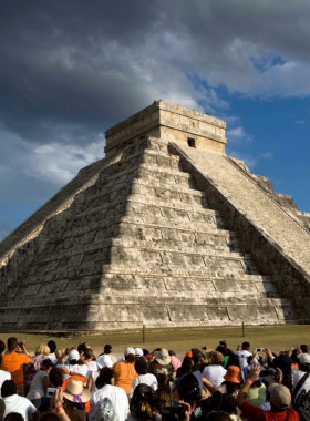 This image shows the iconic El Castillo pyramid at Chichén Itzá, a UNESCO World Heritage Site, highlighting the incredible ancient Maya architecture and historical significance.