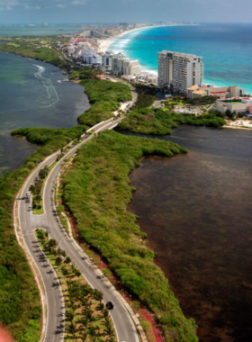  This image shows a peaceful kayak ride through the tranquil waters of Nichupté Lagoon in Cancún, surrounded by lush mangroves and abundant wildlife, ideal for nature lovers.