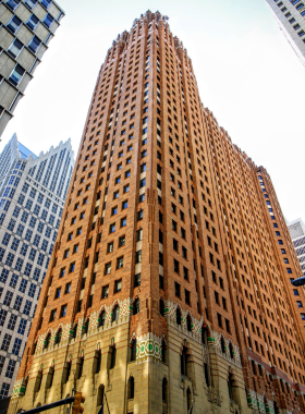 This image shows the stunning interior of the Guardian Building in Detroit, showcasing its vibrant tile mosaics and art deco design.
