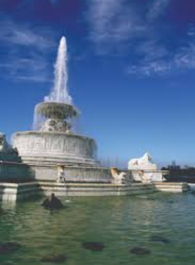 This image shows the natural beauty of Belle Isle Park, featuring lush greenery, the Detroit skyline, and recreational spaces.
