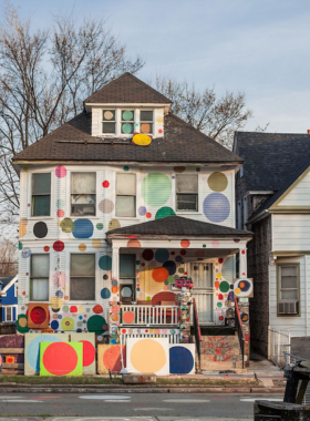 This image shows the Heidelberg Project, an outdoor gallery featuring vibrant and thought-provoking street art made from everyday items.