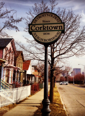 This image shows a cozy restaurant in Corktown, Detroit, with delicious gourmet dishes and a welcoming atmosphere for food enthusiasts.
