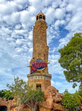 : "This image shows the exhilarating roller coasters at Universal's Islands of Adventure, with visitors screaming with joy while experiencing the thrill of high-speed rides and themed adventures."