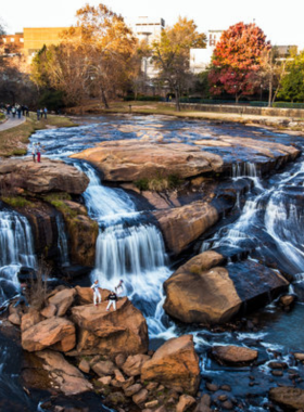 This image shows a peaceful hiking trail near the waterfalls at Falls Park. Surrounded by greenery and scenic views, the trail is a favorite spot for visitors seeking relaxation and natural beauty.
