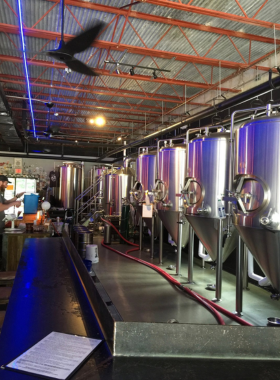 This image shows a table at Swamp Rabbit Brewery with glasses of craft beer and people enjoying the relaxed atmosphere. It’s a popular spot for locals and tourists to unwind after exploring the trail.