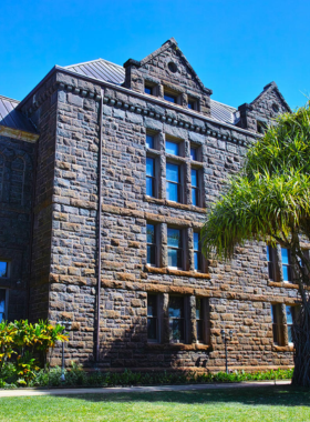 This image shows visitors exploring the cultural exhibits at the Bishop Museum, where they learn about Hawaii’s history and traditions. The museum houses significant artifacts, interactive displays, and the rich cultural heritage of Polynesia.