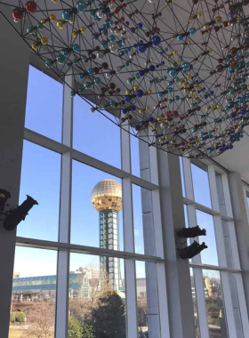 This image shows the Knoxville Museum of Art, with visitors admiring diverse art exhibitions. The museum showcases regional and international art, offering a cultural experience in the city.