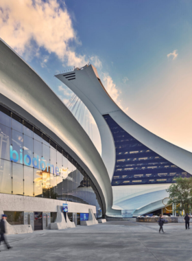 This image shows the diverse ecosystems of the Montreal Biodome, where visitors can walk through tropical rainforests, arctic climates, and other natural habitats.