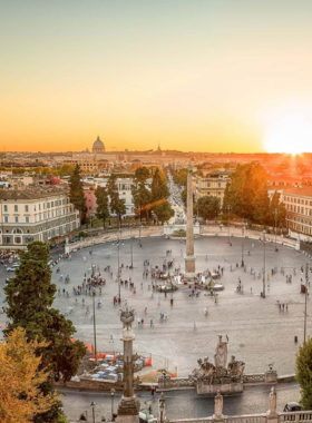  This image shows Piazza del Popolo, a lively Roman square with twin churches, fountains, and the iconic Flaminian Obelisk surrounded by bustling activity.