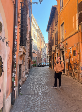  This image shows Trastevere, a charming district in Rome with cobbled streets, cafes, and medieval architecture.