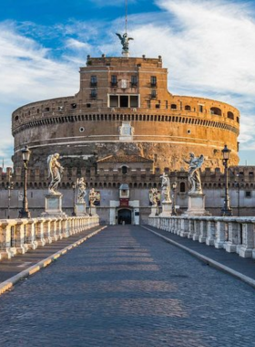 This image shows Castel Sant’Angelo, a historic fortress and mausoleum in Rome, offering scenic views from its rooftop terrace.