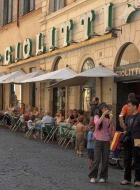 This image shows the famous Giolitti gelateria near the Pantheon in Rome, known for its creamy, authentic gelato. Visitors can enjoy a variety of classic flavors like pistachio or explore unique, exotic combinations. The gelato, served amidst Rome’s historic setting, offers a delightful and refreshing break during sightseeing, making it an essential part of the Roman experience.