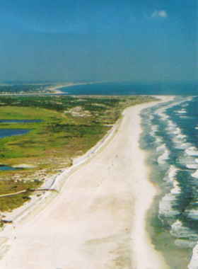 "This image shows Anastasia State Park, a 1,600-acre park offering beautiful beaches, sand dunes, and marshes. Visitors can enjoy hiking, kayaking, biking, fishing, and picnicking in this tranquil natural setting, perfect for a day of outdoor relaxation."
