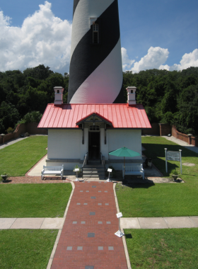 "This image shows the St. Augustine Lighthouse, built in 1871, offering breathtaking views of the coastline and the city. It is one of the tallest structures in St. Augustine and houses a museum that tells the maritime history of the area."