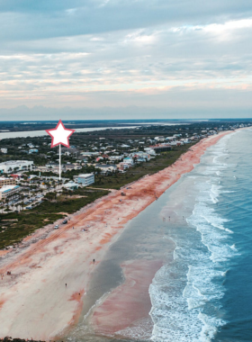 "This image shows Vilano Beach in St. Augustine, a peaceful and less crowded beach perfect for relaxing. Visitors can enjoy sunbathing, walking along the fishing pier, and dining at local restaurants while taking in the tranquil atmosphere."
