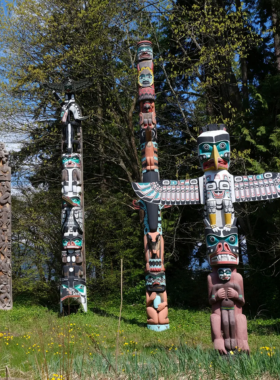 "This image shows the scenic Stanley Park Seawall in Vancouver, with beautiful waterfront views, lush greenery, and the iconic Vancouver skyline in the background."

