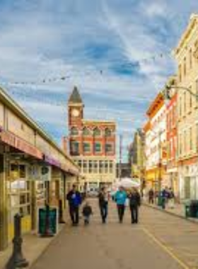 "This image shows art galleries in the Over-the-Rhine District, with visitors admiring contemporary artwork displayed in a blend of historic and modern gallery spaces."