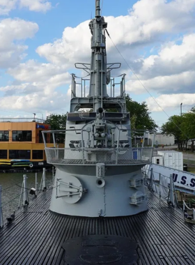 This image shows visitors touring the USS Cod Submarine Memorial in Cleveland, exploring the historical World War II submarine preserved for public education and remembrance.

