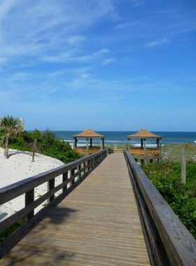 This image shows the tranquil beach at Kathryn Abbey Hanna Park, framed by coastal dunes and blue waters. It illustrates the park’s natural beauty and recreational opportunities, including camping, biking, and enjoying the ocean breeze.