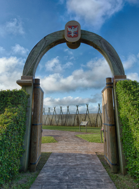 This image shows the reconstructed fort at Fort Caroline National Memorial, surrounded by lush greenery and scenic trails. It illustrates the historical significance of French Huguenot settlers and their early attempts to colonize the area.