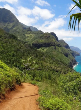  "This image shows the breathtaking beauty of Napali Coast in Kaua’i, featuring towering cliffs, lush green valleys, and the vast Pacific Ocean in the background."

