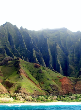 "This image shows Koke’e State Park, a lush area on Kaua’i’s West Side, featuring breathtaking views of Waimea Canyon and the Napali Coast’s rugged cliffs."