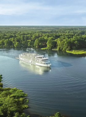  "This image shows a scenic riverboat cruise on the Mississippi River in Memphis, offering stunning views of the city's skyline and surrounding nature, perfect for relaxing and enjoying the beauty from the water."