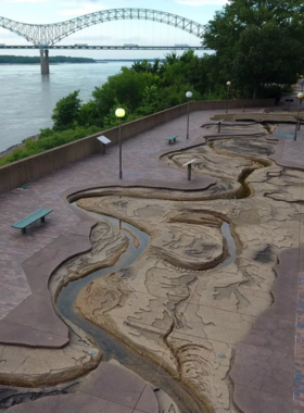 "This image shows the beautiful Mississippi Riverfront Walk in Memphis, where visitors enjoy scenic views, walking paths, and outdoor cafes along the iconic river."
