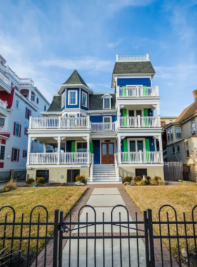 This image shows the serene beach at Cape May, with soft sands, gentle waves, and Victorian houses lining the horizon, reflecting the town's rich history.