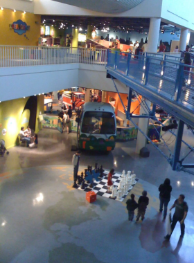 This image shows children engaging with colorful, interactive exhibits at Marbles Kids Museum, emphasizing creativity and fun learning.

