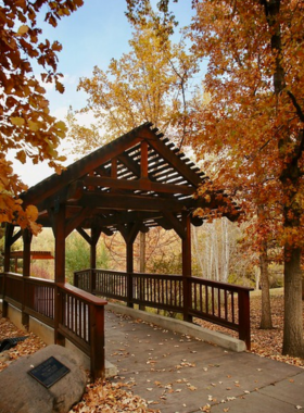 This image shows the scenic Rancho San Rafael Regional Park in Reno, featuring expansive green spaces, walking trails, and the tranquil Wilbur D. May Museum. The park offers a peaceful escape for families, with areas for picnics, hiking, and enjoying nature.