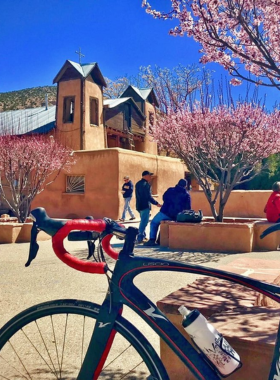 This image shows a cycling tour group in Santa Fe, exploring the city’s scenic streets, historic landmarks, and outdoor beauty on two wheels