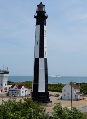 This image shows that Cape Henry Lighthouse offers panoramic views of the Chesapeake Bay and rich history, with visitors able to climb the lighthouse and enjoy breathtaking coastal vistas from the top.