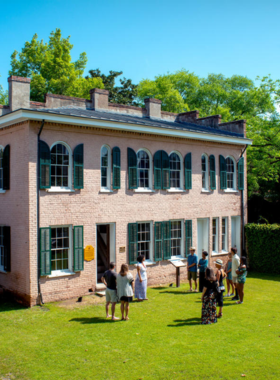  This image shows the Bellamy Mansion, a historic site in Wilmington, with its grand Greek Revival architecture and lush gardens, offering a glimpse into the city’s 19th-century history.