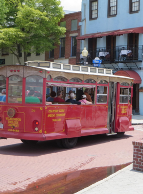 This image shows a charming trolley on a historic tour in Wilmington, offering an informative and scenic way to explore the city’s historic landmarks and neighborhoods.