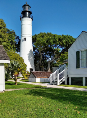 This image shows the Key West Lighthouse, a historic site offering stunning panoramic views of the island and surrounding ocean. Visitors can climb to the top and learn about its significance in guiding ships safely into port.