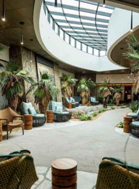 This image shows the luxurious hot springs at The Spa at Séc-he, with steam rising from the warm waters, offering a peaceful environment for relaxation and rejuvenation.