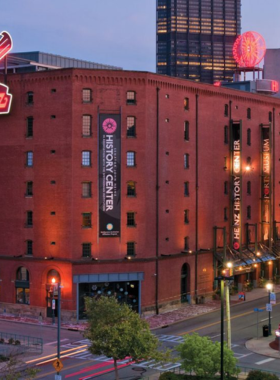  "This image shows the grand brick exterior of the Senator John Heinz History Center, a six-story museum in Pittsburgh. The building’s historical design reflects the region’s heritage, standing tall as an educational landmark for Western Pennsylvania’s history."