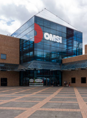 This image shows visitors exploring interactive exhibits at the Oregon Museum of Science and Industry (OMSI) in Portland. The museum offers engaging science displays and educational experiences, making it fun for all ages.

