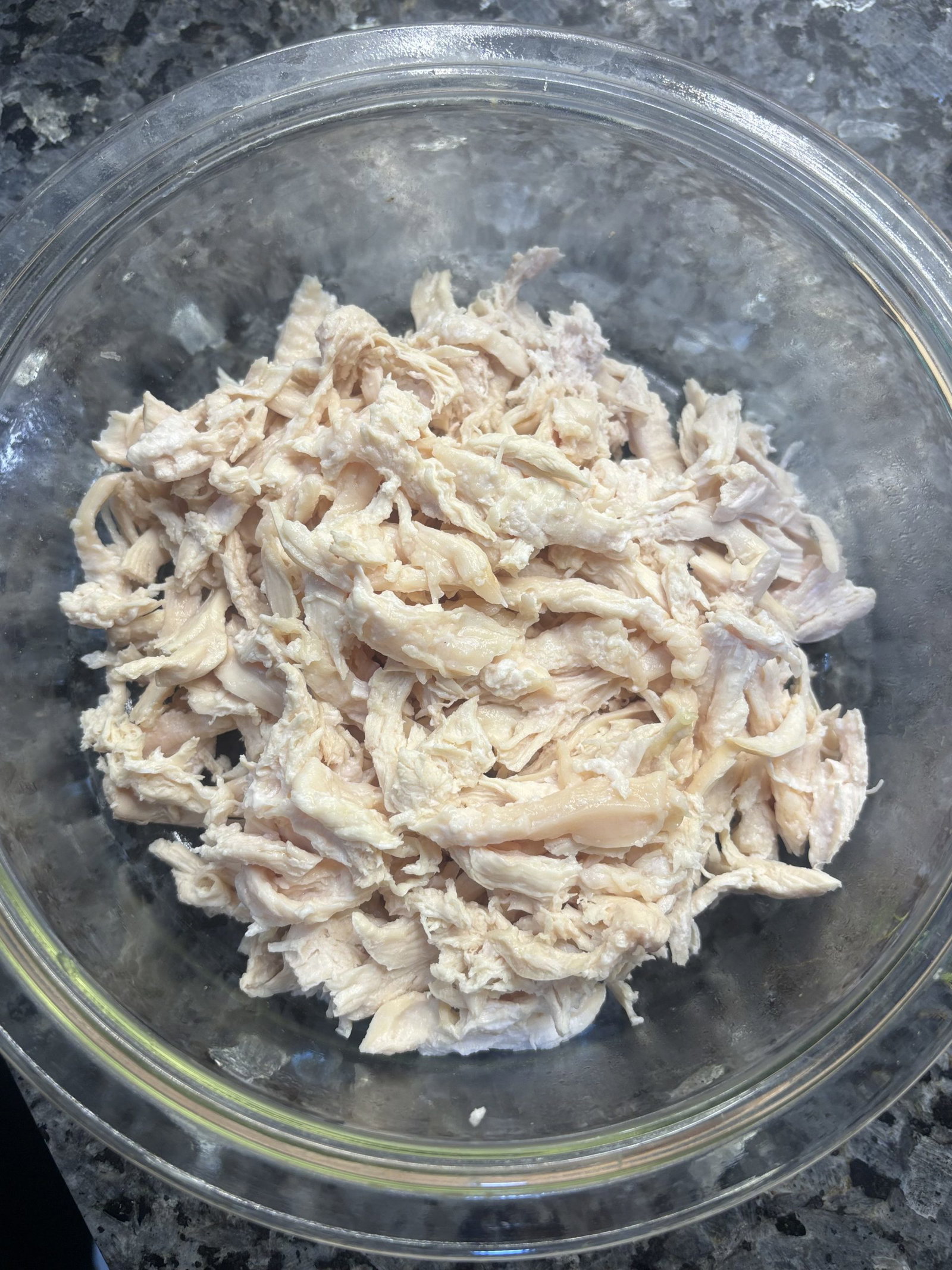 The shredded chicken goes in next to warm through.