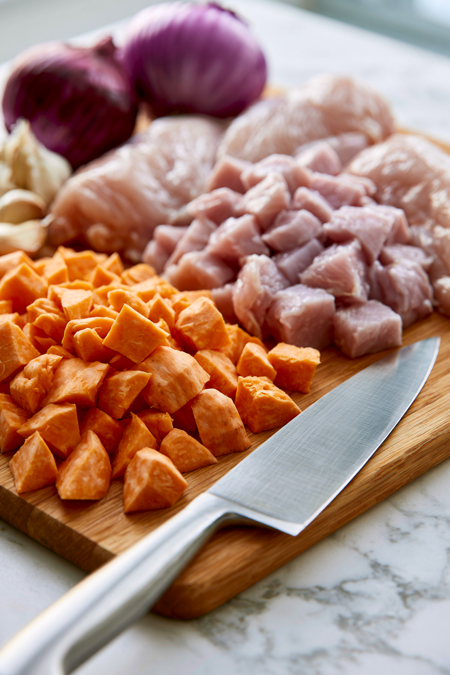 Chop the chicken and sweet potatoes into even pieces