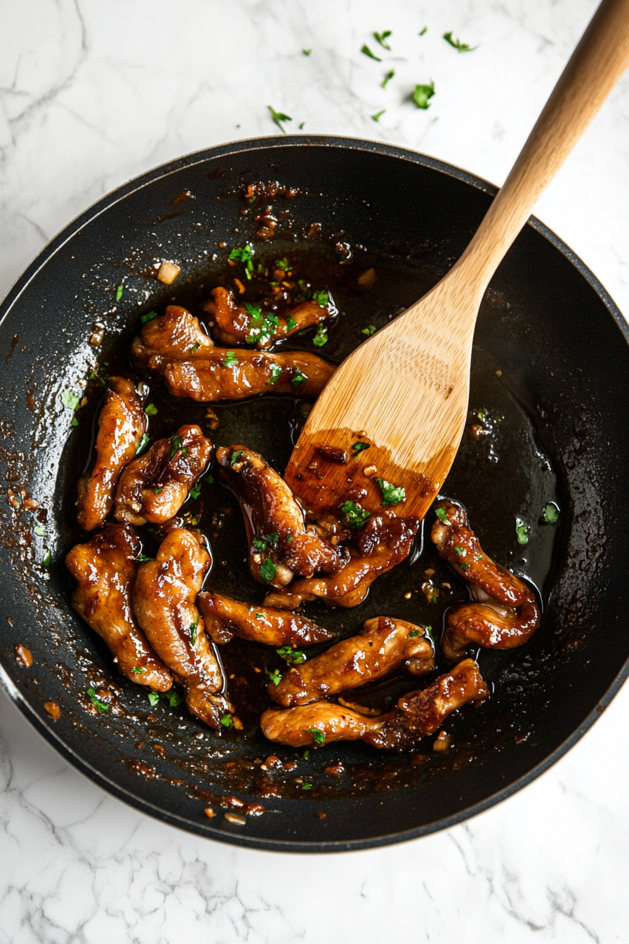 Pour in dark soy sauce, oyster sauce, and sugar. Mix well.
