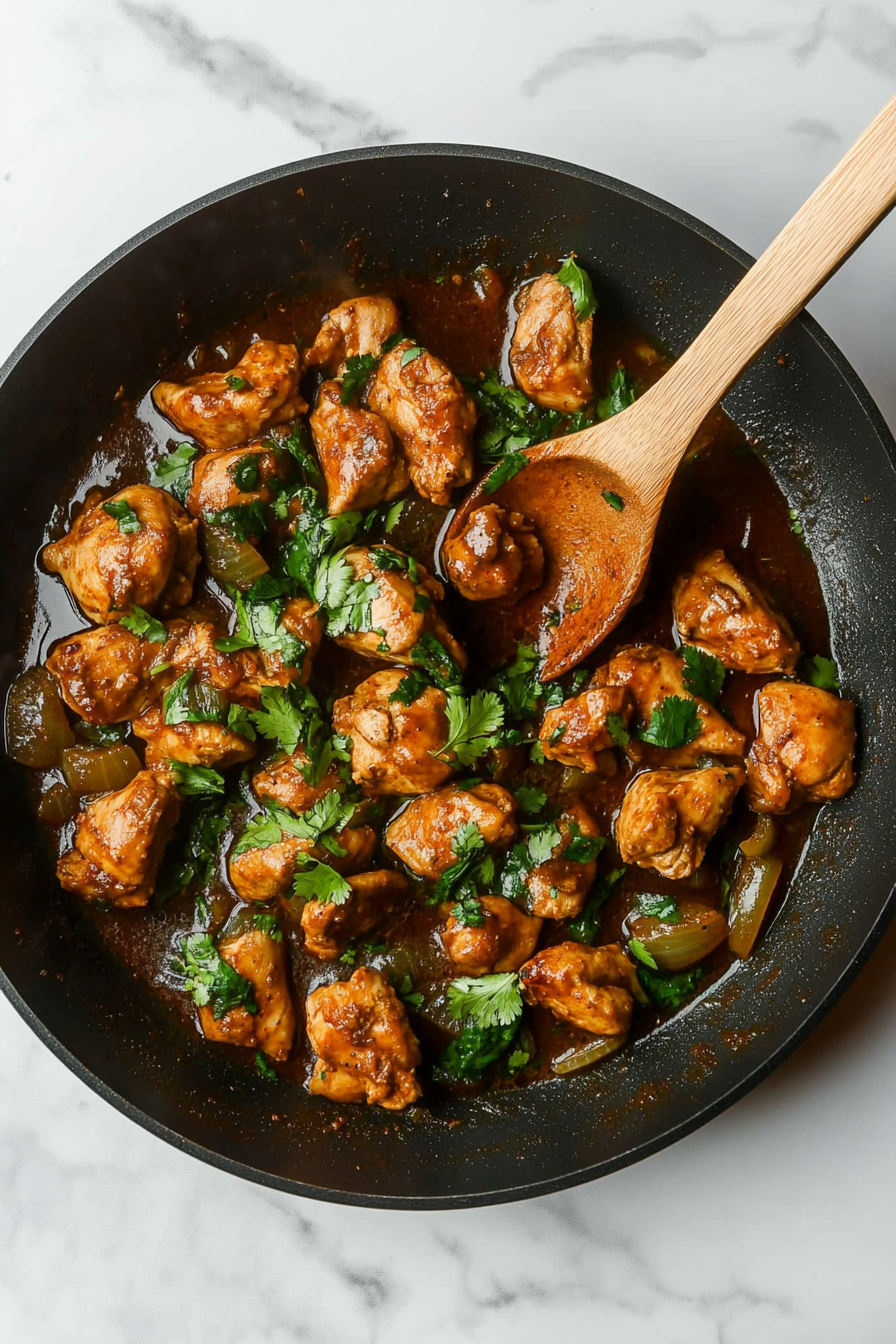 Add green chillies, mint, coriander, and marinated chicken. Cook until chicken is tender.