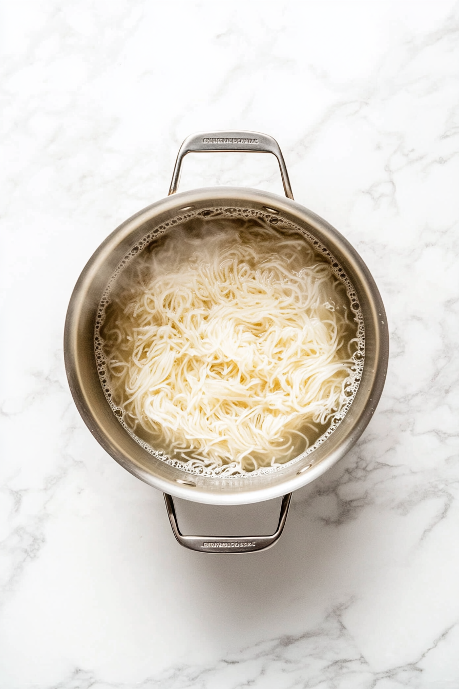 Meanwhile, cook pho noodles in a separate saucepan according to package instructions. Drain and set aside.