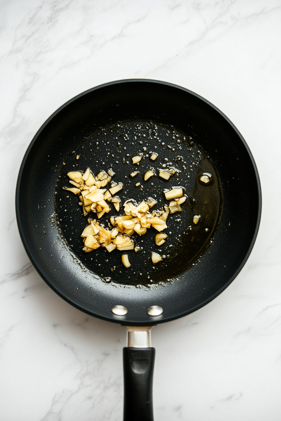 Sauté garlic and ginger for a minute until fragrant.