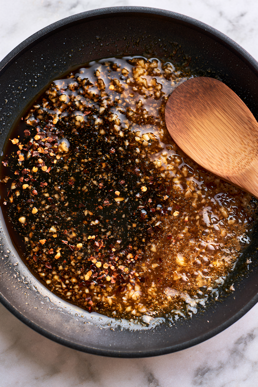 Pour in soy sauce and sprinkle in brown sugar
