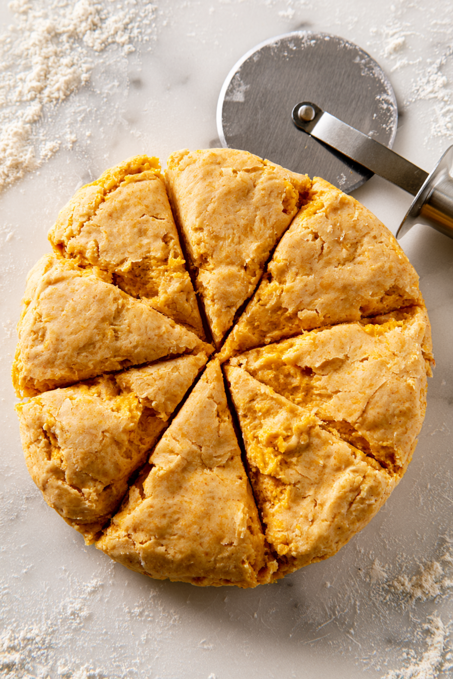 Pat the dough into a 1-inch thick circle. Use a sharp knife or pastry cutter to cut the circle into 8 wedges