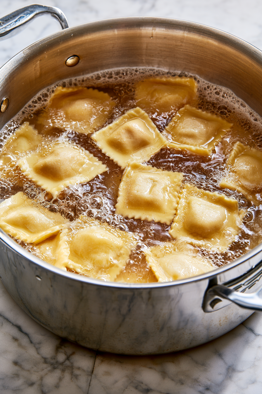 Bring a large pot of salted water to a gentle boil. Carefully drop the ravioli in, working in batches if needed