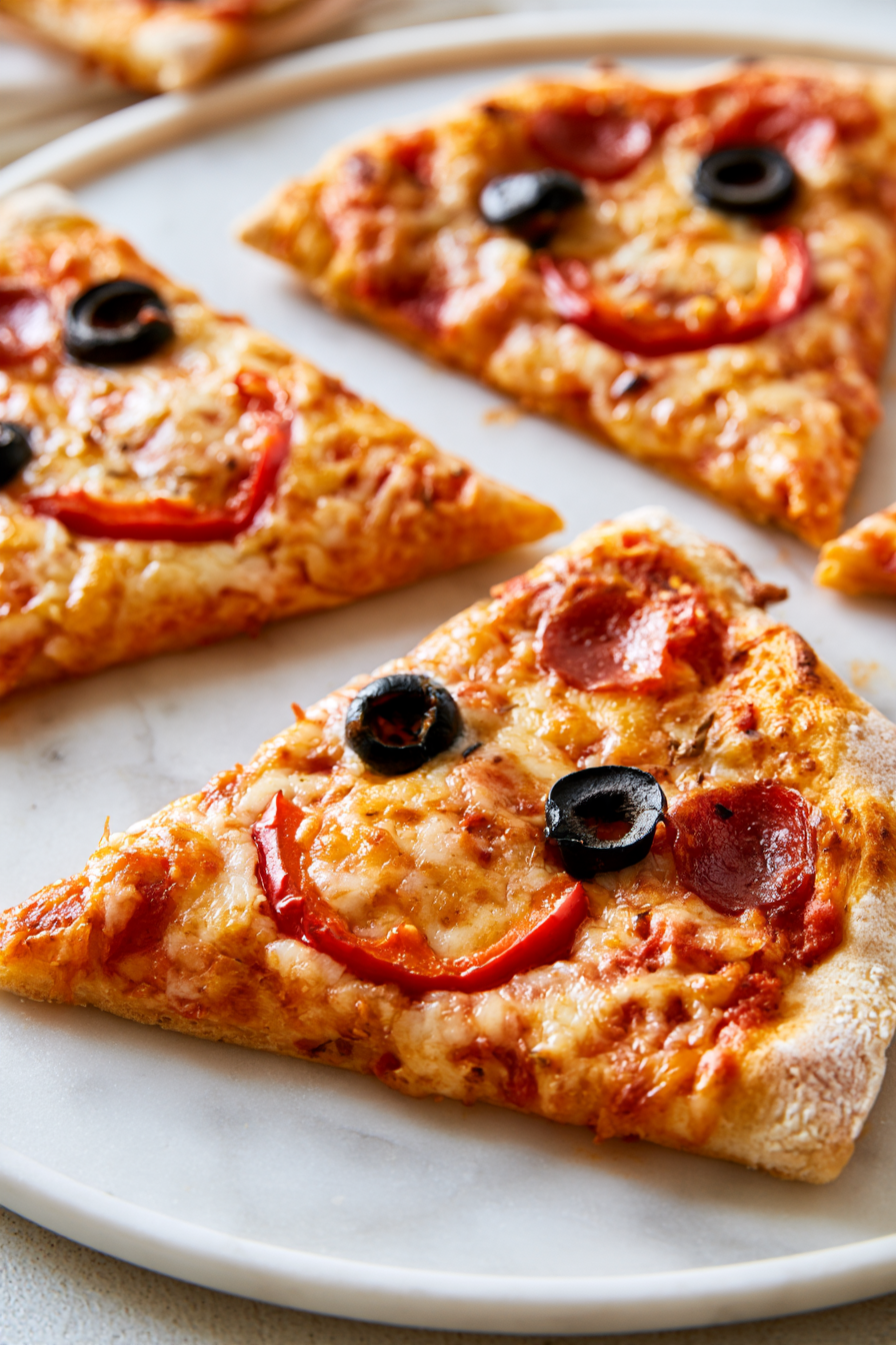 Slice the pizza into wedges, serve hot, and enjoy the playful, spooky feast