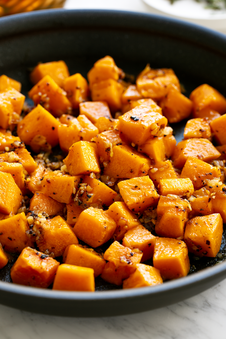 Stir in the pumpkin cubes, coating them with the aromatic mixture, and cook for another 5 minutes
